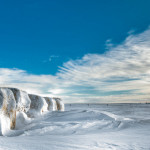 PHOTONews Winter 2010 Challenge Snow Covered Hay Bales Grassy Lake Alberta Patrick Kavanagh